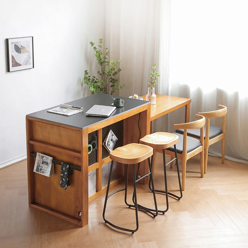 Mesa de cocina moderna de piedra negra con base de madera sólida y cajones