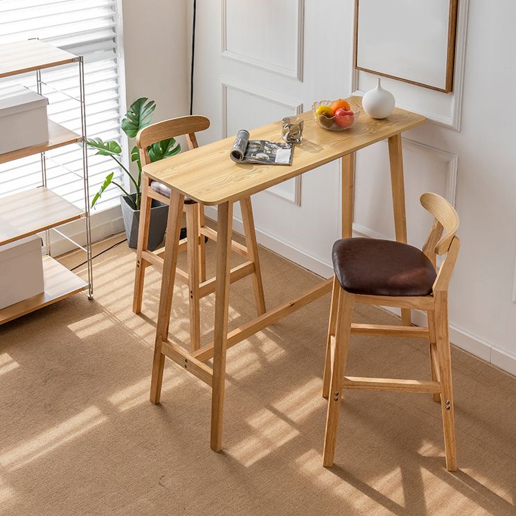 Modern Style Bistro Bar Table Rectangle Solid Wood Bar Table with Footrest Clearhalo 'Bar Furniture' 'Bar Tables' 'bar_tables' 'furn' 'furn_bar_tables' 'Furniture' 'Kitchen & Dining Furniture' 1200x1200_687f7b97-4078-41be-8faf-685802a0ec85
