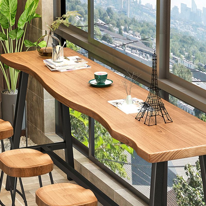 Living Room Modern Patio Bar Table Solid Wood Natural Footrest Bistro Bar Desk Clearhalo 'Bar Furniture' 'Bar Tables' 'bar_tables' 'furn' 'furn_bar_tables' 'Furniture' 'furniture_bar_tables' 'Kitchen & Dining Furniture' 1200x1200_6b6641c5-f3f2-4015-8c64-807c98b479e5