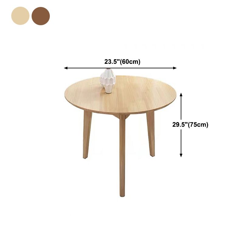 Mesa de comedor redonda de roble.