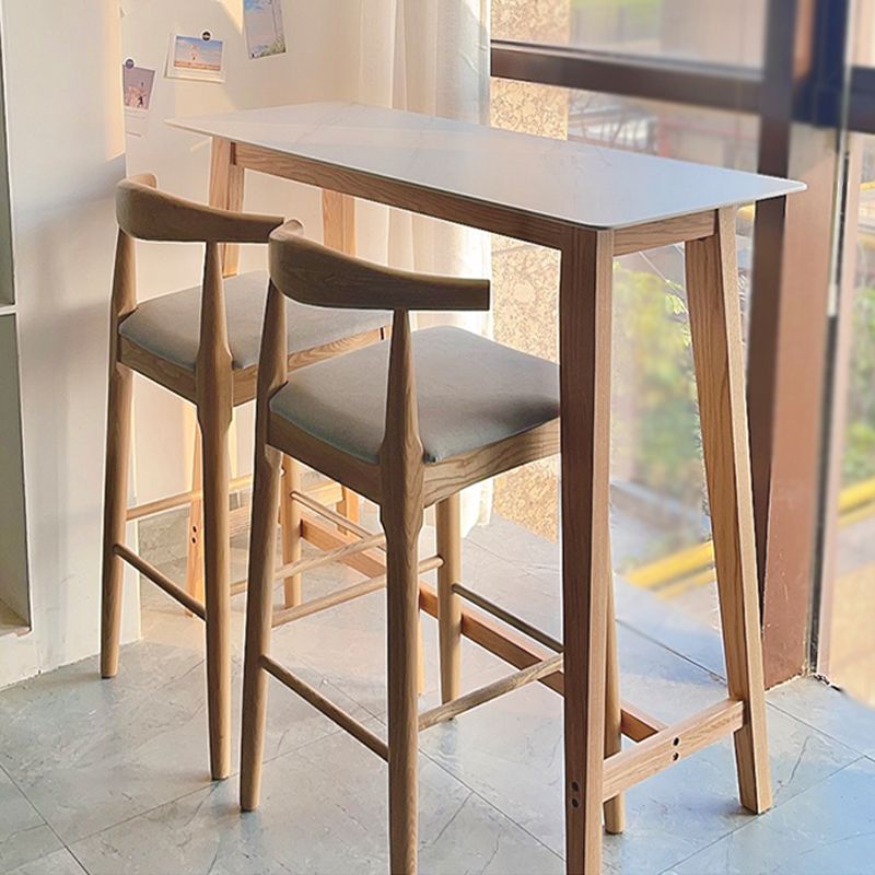 Tavolo da bistrò rettangolare con piano in pietra Tavolo da pub moderno con struttura in legno massello