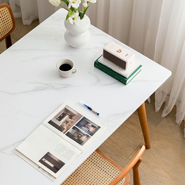 Table à manger rectangulaire blanche contemporaine avec des pattes en bois massif