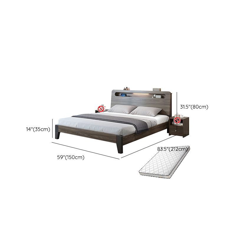 Lit standard en bois dans un lit de panneau gris avec tête de lit rectangulaire