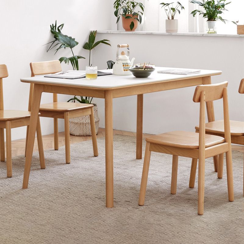Mesa de comedor rectangular de piedra moderna con patas de madera para comedor
