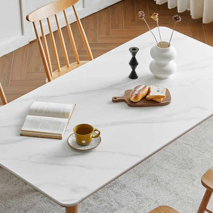 Moderne massief houten poten eettafel met rechthoekig stenen blad