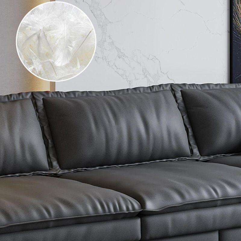 Canapé noir moderne du milieu du siècle avec un bras toret et dos lâche