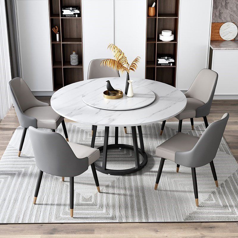 Mesa de comedor de base de hierro negro redondo Mesa de pedestal de piedra moderna