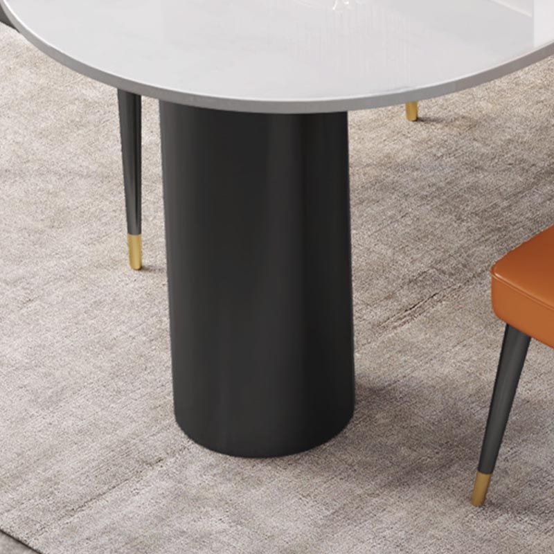 Table à manger en pierre moderne en pierre de fer ovale avec table de 3 jambes