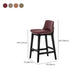 Taburete de bar de cuero con respaldo para mostrador Bristol con patas de madera
