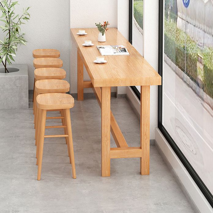 Modern Beige Wood Bar Dining Table Rectangle Indoor Bistro Table with Footrest Clearhalo 'Bar Furniture' 'Bar Tables' 'bar_tables' 'furn' 'furn_bar_tables' 'Furniture' 'furniture_bar_tables' 'Kitchen & Dining Furniture' 1200x1200_8901cdab-d473-489f-a418-52005d65703c