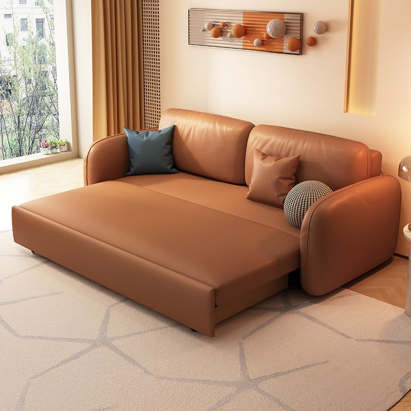 茶色の枕付きフェイクレザーソファー