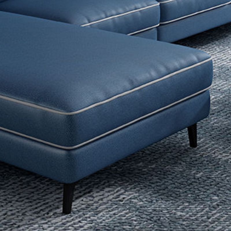 Sectionnel en faux cuir en L avec bras encastrés et rangement