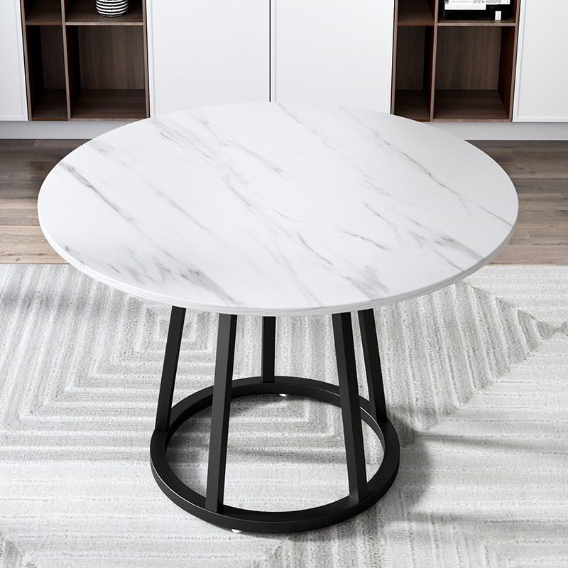 Mesa de comedor de base de hierro negro redondo Mesa de pedestal de piedra moderna
