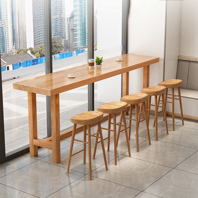 Modern Beige Rectangle Bar Dining Table Pine Wood Indoor Bistro Table with Footrest Clearhalo 'Bar Furniture' 'Bar Tables' 'bar_tables' 'furn' 'furn_bar_tables' 'Furniture' 'furniture_bar_tables' 'Kitchen & Dining Furniture' 1200x1200_8d179914-c7e0-43d1-bae2-ea4b84b6f390