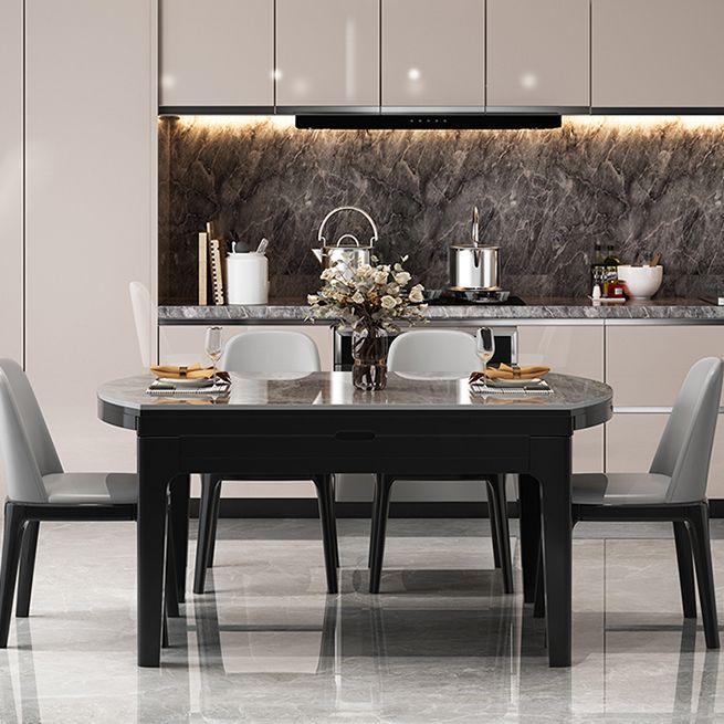 Moderner runder graues Steinoberteil ausziehbar einziehbarer Esstisch mit 4 schwarzen Beinen mit Gummiholzbeinen