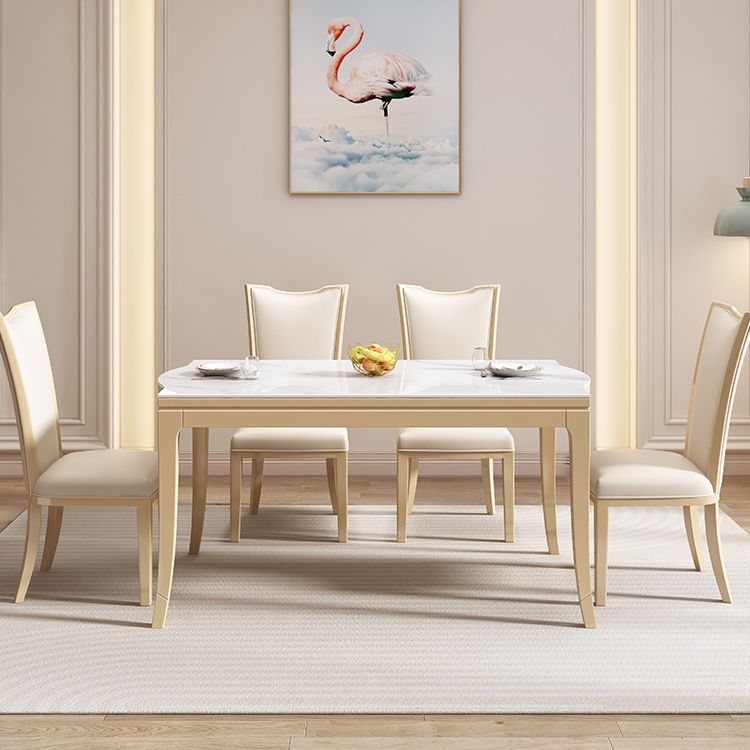 Table à manger moderne en pierre blanche avec pieds en bois massif pour le salon