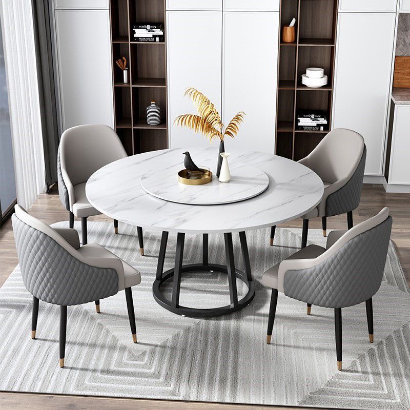 Mesa de comedor de base de hierro negro redondo Mesa de pedestal de piedra moderna