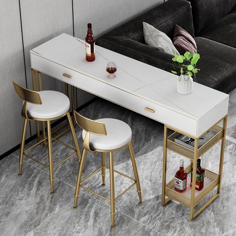 Bistro-bartafel van gesinterd steen, onderstel met goudkleurig frame en lades