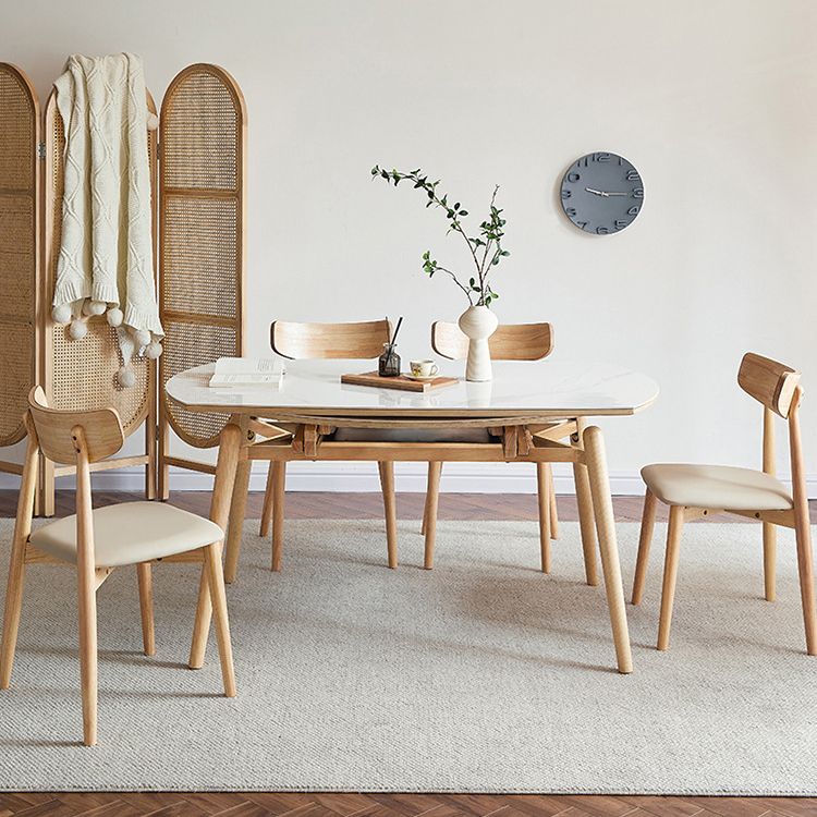 丸い焼結ストーンダイニングテーブルは、家のために4本の脚を備えたモダンな拡張可能な家具