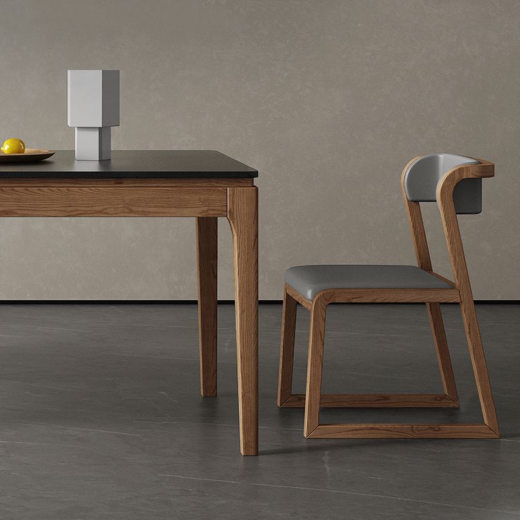 Moderne rechthoekige stenen eettafel met houten poten voor eetkamer