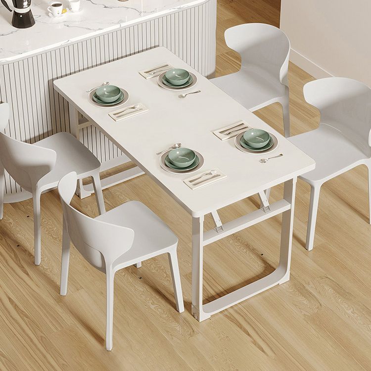 Mesa de comedor blanca plegable moderna con base de trineo de acero para comedor