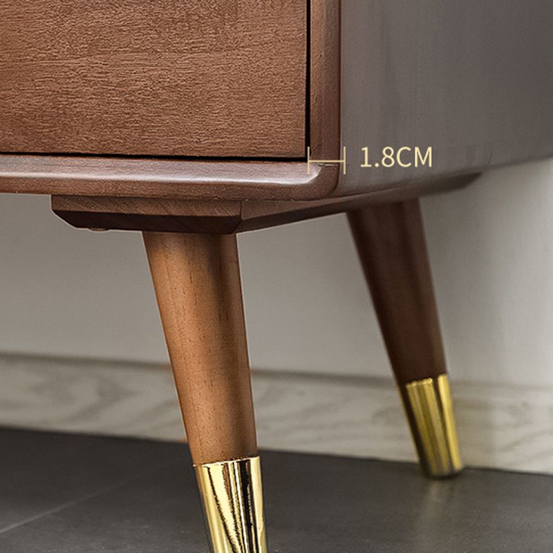 Cassettiera verticale Glam in legno massello con piedini in metallo