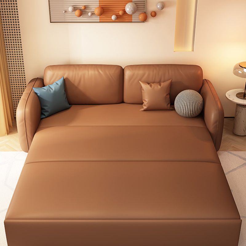 茶色の枕付きフェイクレザーソファー