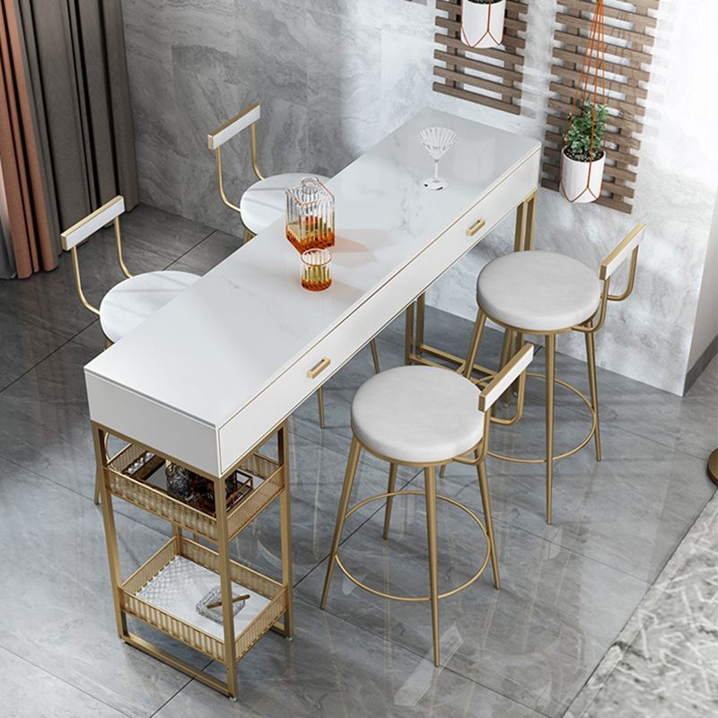 Bistro-bartafel van gesinterd steen, onderstel met goudkleurig frame en lades