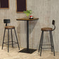 Industrieller Bistro-Stehtisch mit Sockel aus massivem Holz und Metall