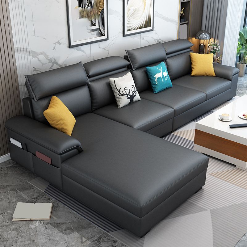 モダンスタイルのソファベッドソリッドウッドフレーム模倣レザービルトインアームレストソファ