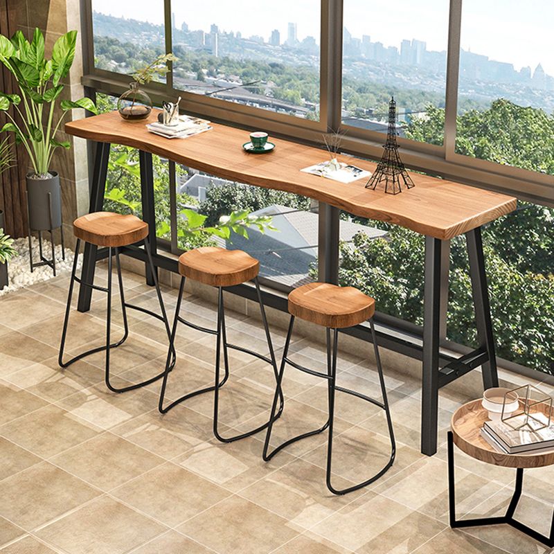 Living Room Modern Patio Bar Table Solid Wood Natural Footrest Bistro Bar Desk Clearhalo 'Bar Furniture' 'Bar Tables' 'bar_tables' 'furn' 'furn_bar_tables' 'Furniture' 'furniture_bar_tables' 'Kitchen & Dining Furniture' 1200x1200_9b4502c0-a013-4268-8ba1-f4b1386dda4e