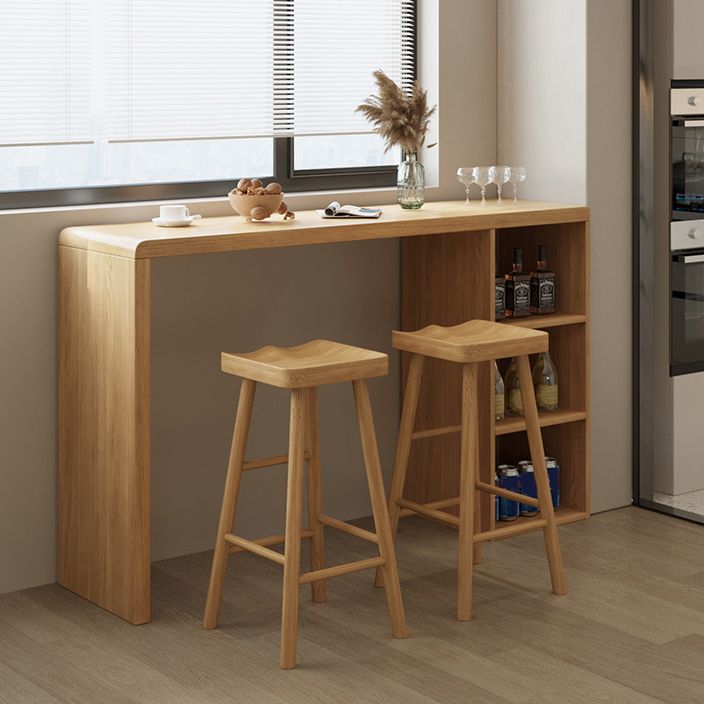 Solid Wood Bar Dining Table Pedestal Rectangle Bistro Bar Table in Natural with Shelves Clearhalo 'Bar Furniture' 'Bar Tables' 'bar_tables' 'furn' 'furn_bar_tables' 'Furniture' 'Kitchen & Dining Furniture' 1200x1200_9b636f18-73c9-45b8-a0bf-32c4379d70c2