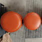 Orange Leather Solid Color Pouf Round Water Resistant Indoor Pouf Clearhalo 'furn' 'furn_ottomans_poufs' 'Furniture' 'Living Room Furniture' 'Ottomans & Poufs' 'ottomans_poufs' 1200x1200_9ef045b2-0a1a-4ed6-a7ed-5a30b7a82bd5