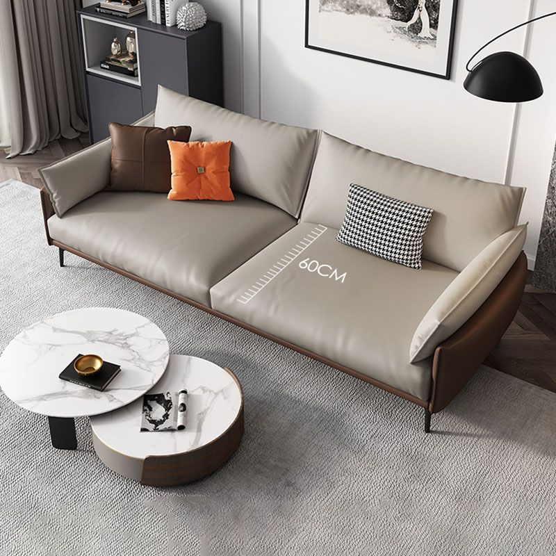 Sofá de cuero moderno de brazo de almohada en marrón con patas de metal