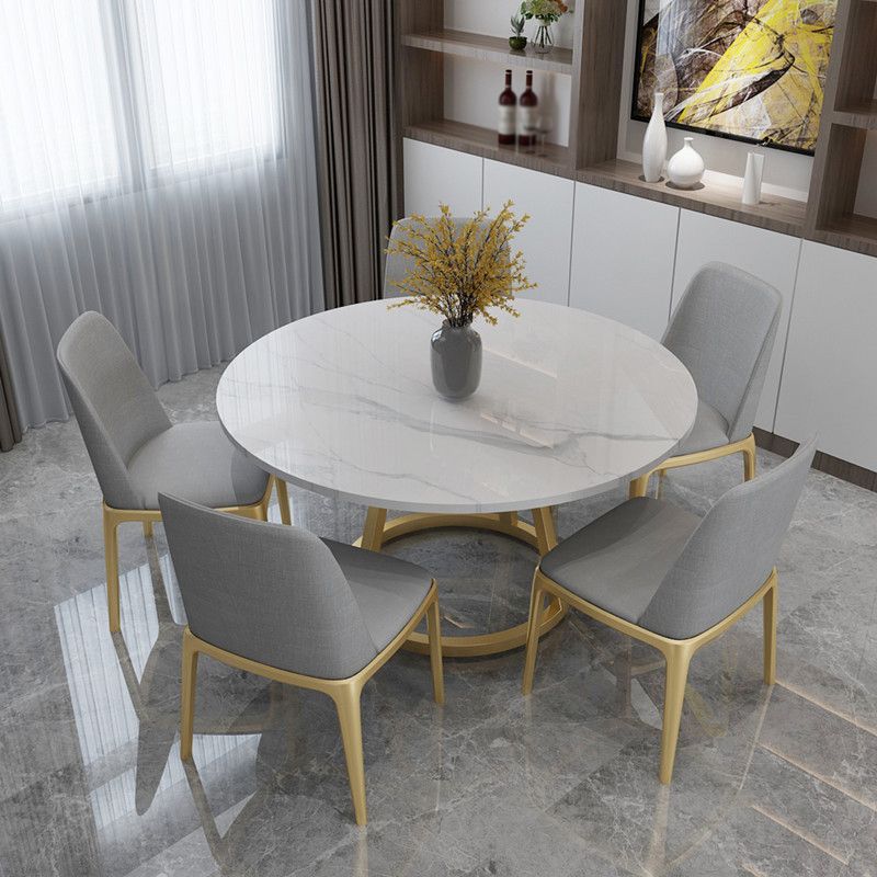 Mesa de comedor redonda contemporánea Mesa de pedestal de hierro con tapa de piedra sinterizada