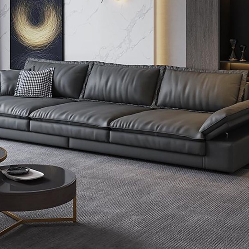 Canapé noir moderne du milieu du siècle avec un bras toret et dos lâche