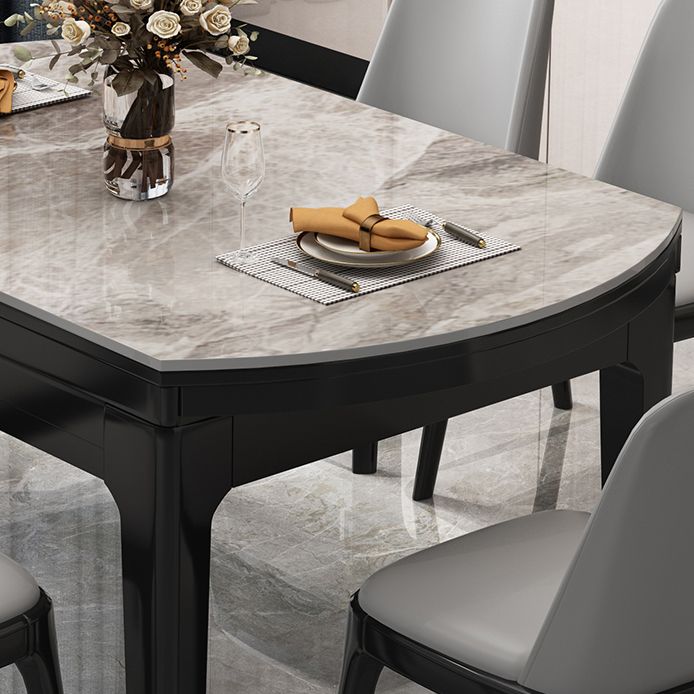 Moderner runder graues Steinoberteil ausziehbar einziehbarer Esstisch mit 4 schwarzen Beinen mit Gummiholzbeinen