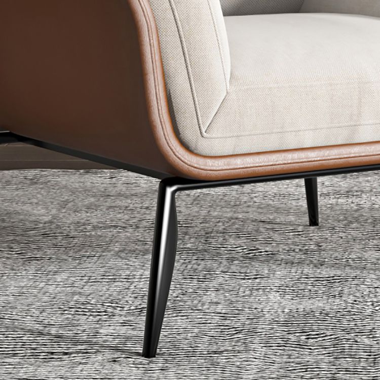 Contemporary Fabric Armrest Cushioned Against Brown Arm Chair