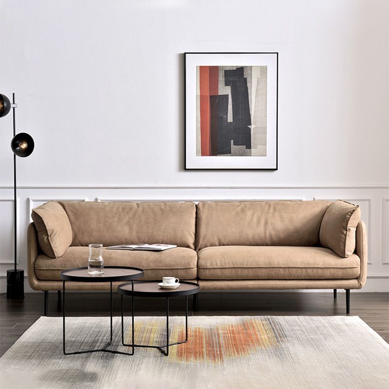 Seccionales de color marrón claro/sofá con almohada y brazo superior de almohada