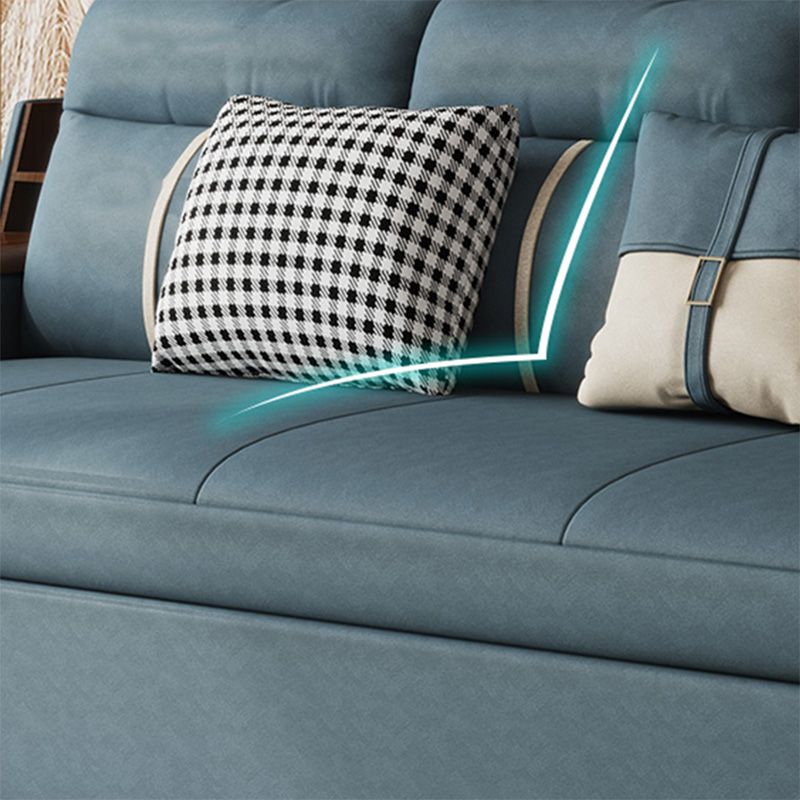 Canapé-lit bleu scandinave avec rangement et coussin en arrière