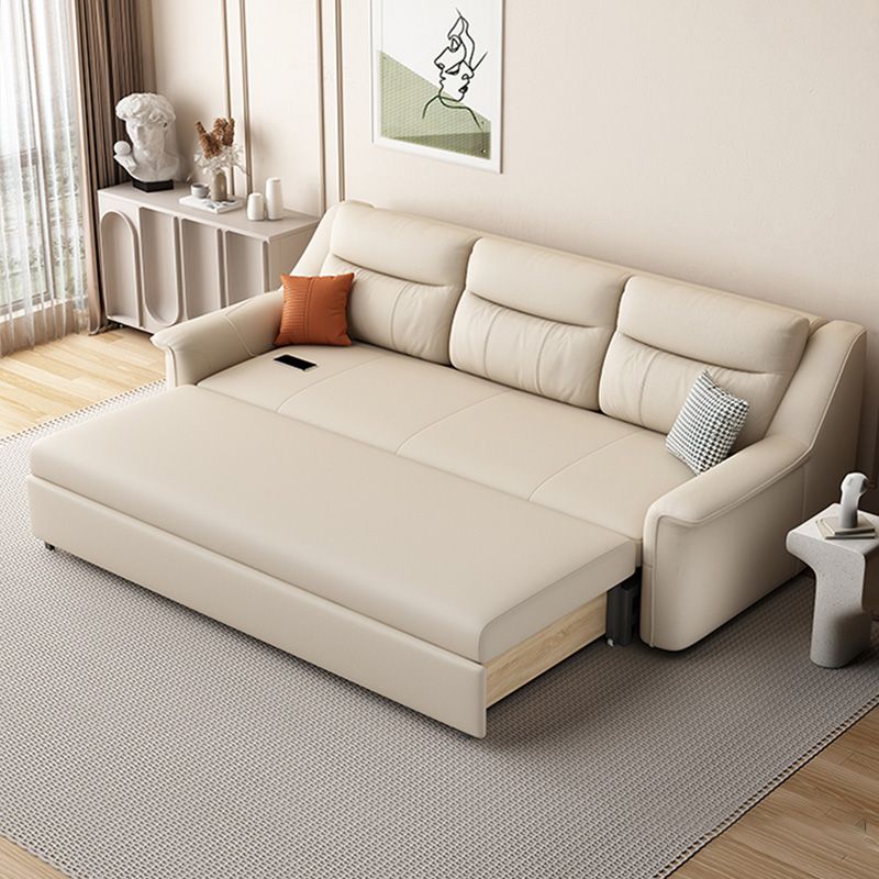 Canapé-lit beige futon beige de style glamour avec dos lâche en cuir collé