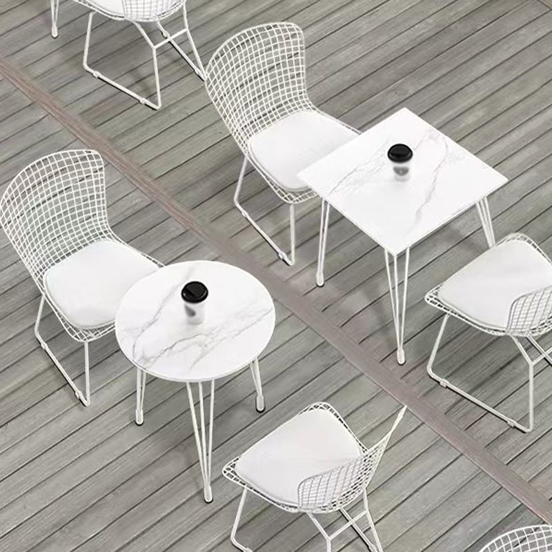 Mesa de comedor al aire libre con trípode Mesa de cena moderna con base metálica y tapa de piedra