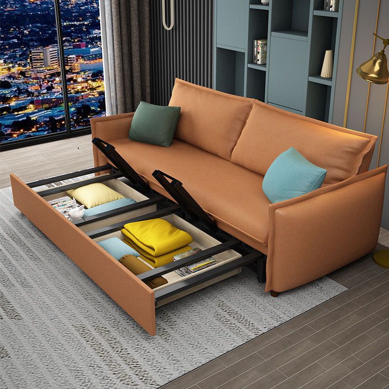 Canapé-lit orange en s'amuser avec 2 oreillers en arrière et bras carré