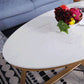 Glam Style Cocktail Table with Oval Top and Golden Iron Cross Base