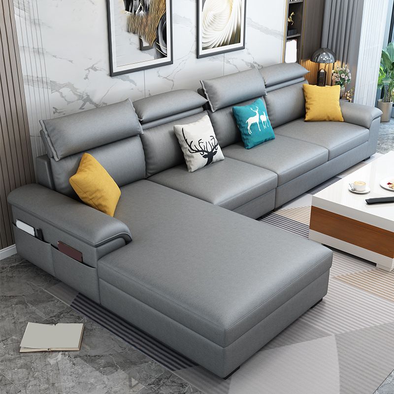 モダンスタイルのソファベッドソリッドウッドフレーム模倣レザービルトインアームレストソファ