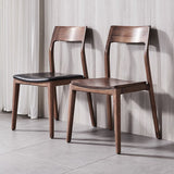 Eigentijdse binnenwalnoot massief hout open achterkant eetstoel