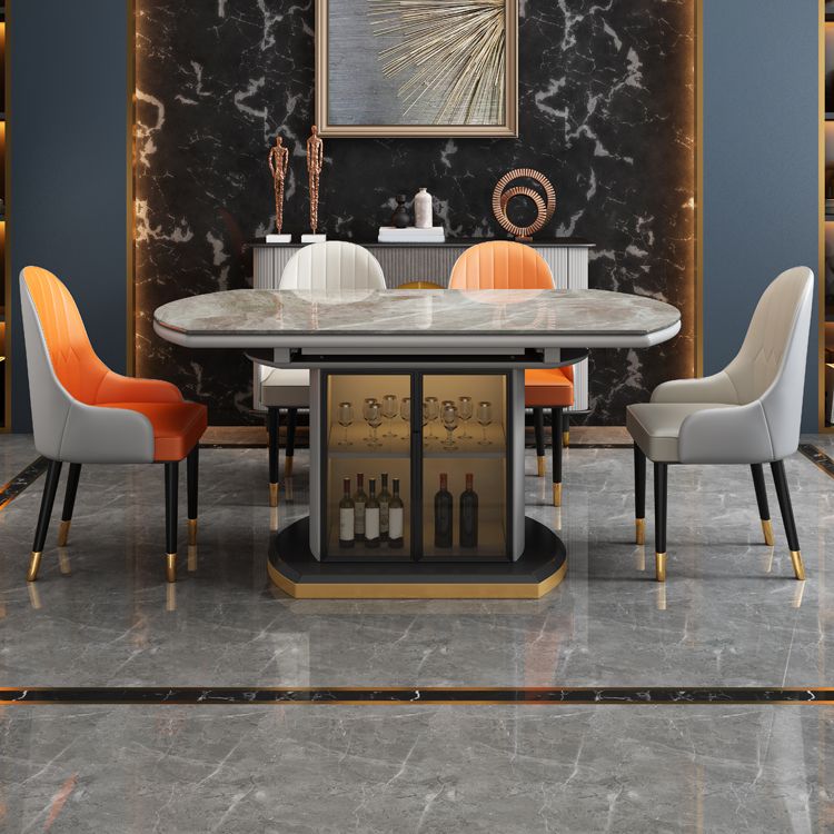 Moderne uitschuifbare eettafel rond stenen tafelblad met opbergruimte