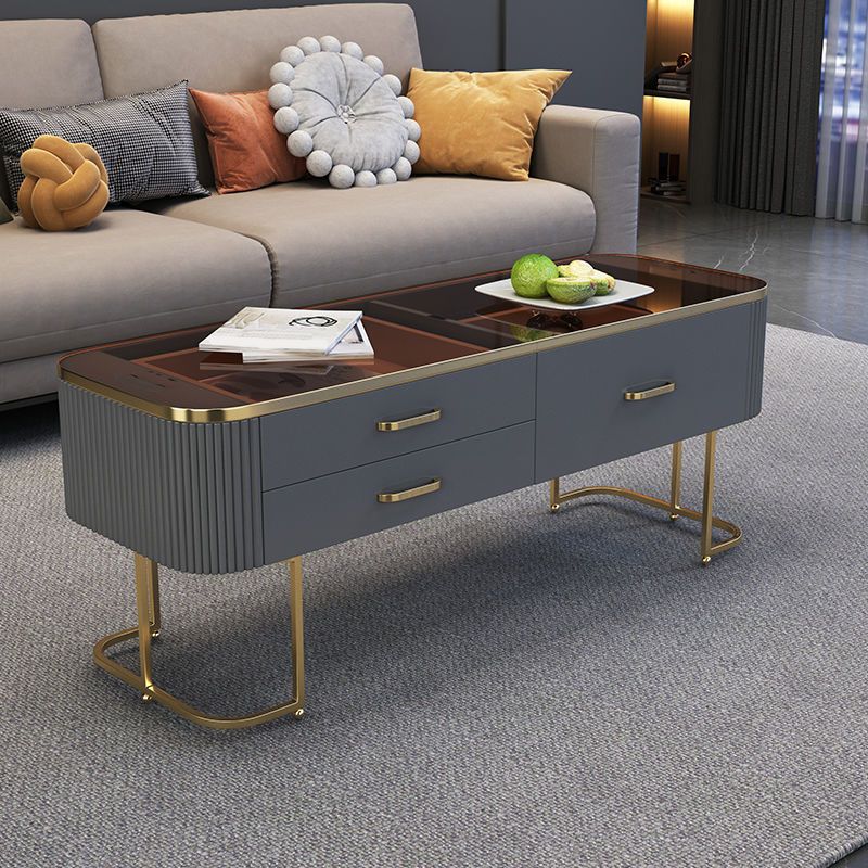 Eigentijdse salontafel met opberglade en gouden framebasis