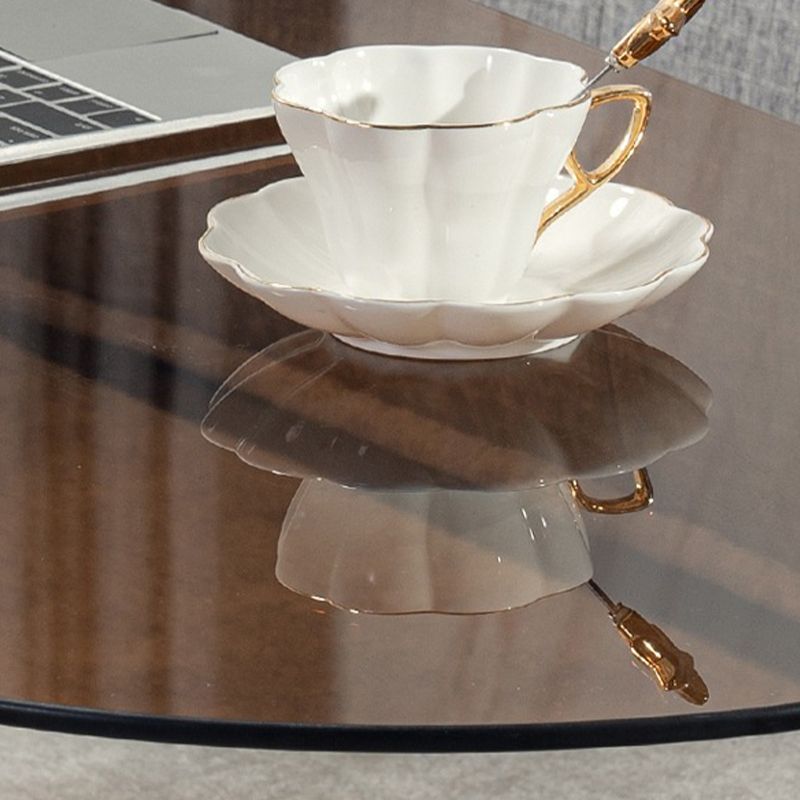 Contemporary Oval Glass Top Coffee Table with 3 Wooden Legs Cocktail Table Clearhalo 'Coffee & Accent Tables' 'Coffee Tables' 'coffee_tables' 'furn' 'furn_coffee_tables' 'Furniture' 'Living Room Furniture' 1200x1200_bdbe1452-9146-46e6-9e90-8c9f7a71e225