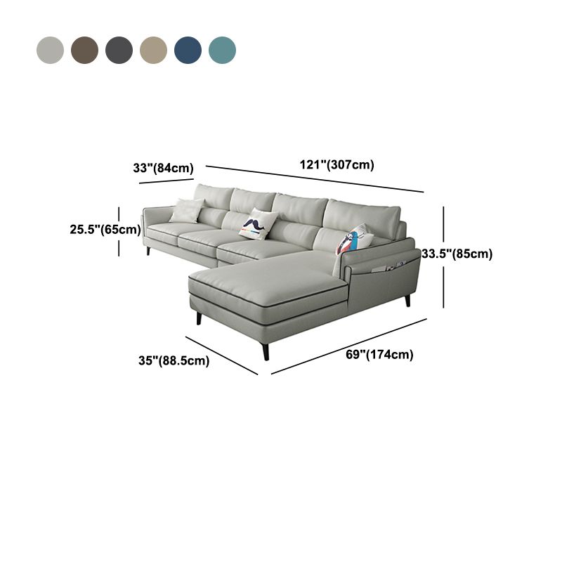 Sectionnel en faux cuir en L avec bras encastrés et rangement